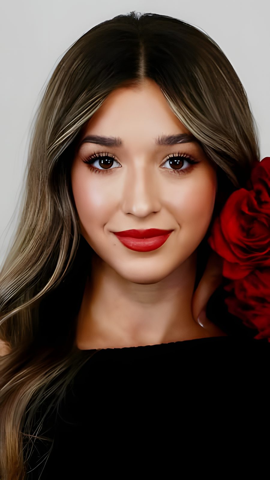 Portrait of a candidate holding a red rose